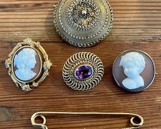 Item 452:  14k 19th c Pin (top):  $175.                                                                     Item 453:  14k Shell Cameo Pin (2nd row left):  $125.                              Item 454:  14k Amethyst Pin (2nd row middle): $80.                                Item 455:  10k Antique Cameo Pin (2nd row right):  $65 (SOLD)                                                                                                 
Item 456:  14k Antique Safety Pin (bottom):  $95