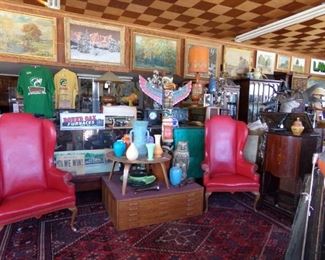 NATIVE AMERICAN TOTEM, LEATHER WING BACK CHAIRS WITH BRASS TACKS. ROUND OAK STOVE SIGN FROM DOWAGIAC.