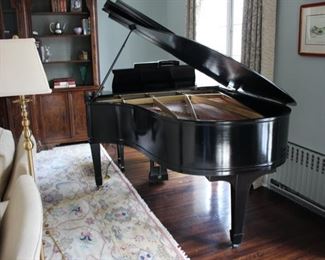 1934 Chickering grand piano with needlepoint bench.