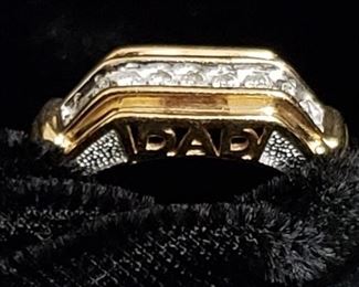 https://ctbids.com/#!/description/share/721046 Diamond and gold men's ring with the word DAD embellishing each side. Size 12. Perfect gift for Father's Day or for a new dad. Diamonds test as such using the HDE Diamond Selector II and were verified by a jeweler. 10K gold ring measures slightly over 2 cm in diameter measuring from the interior of the ring and weighs 5 grams.