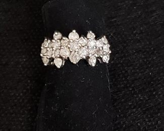 https://ctbids.com/#!/description/share/721048 Multi-stone diamond ring with floral shaped center cluster. 10k gold setting and 25 authentic diamonds. Diamonds registered as authentic using the HDE Diamond Selector II diamond tester and were verified by a jeweler. Ring weighs 5 grams.