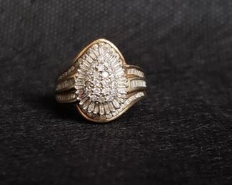 https://ctbids.com/#!/description/share/721044 Numerous authentic diamonds join together to form this gorgeous pear-shaped cluster ring in a yellow gold setting. Diamonds test as such using the HDE Diamond Selector II and were verified by a jeweler. The mark on the gold is very small but it either says 10K or 18K. Approximately a size 7 with the ring guard that is attached. Only slightly larger without it. Pear cluster measures 3/4" long and approximately 1/2" wide. Weighs 6 grams. All stones are present.