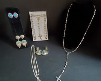 https://ctbids.com/#!/description/share/721053 Stainless silver rosary measures 19" Vintage silver tone Miraculous Mary Promoter 1" pendant with chain 15" 3 pairs of silver and turquoise earrings. Pair with palm trees 3" do have a little weight to them. Studs 1" Heart earrings have clasps and are 1.75" Authenticity of stones and metal could not be determined.