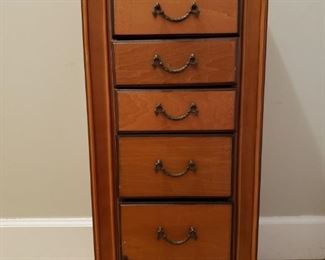 https://ctbids.com/#!/description/share/721120 Wooden armoire with beautiful hardware. This is a beautiful piece that needs just a few tweaks to get it back to its optimal condition. Tons of storage space for organizing your jewelry collection. The piece measures 13" wide, 9" deep, and 30.5" high.