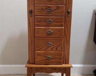 https://ctbids.com/#!/description/share/721125 Six-drawer jewelry armoire with additional storage under the lid and on each side. This piece is quite heavy and measures 16.5" wide, 12" deep, and 40" high.