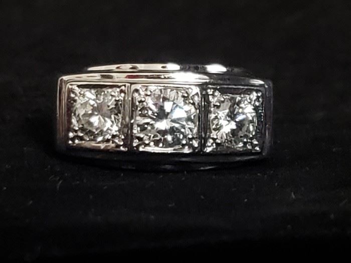 https://ctbids.com/#!/description/share/721135 **There is a reserve of $2,500 for this ring. If the ring does not meet the reserve price, the owner will consider the highest bid but is not obligated to accept it.**

Men's three stone diamond ring with diamonds totaling approximately 1.75 carats set in a 14k white gold band. Size 12. The clarity is I1 and the color is H-J. Approximate retail value is $4,500. The sides of the band have a brushed texture that tapers to a smooth surface on the bottom portion of the ring. Absolutely stunning! The information on the diamonds and value was provided by a gemologist at Windsor Jewelers in Augusta, GA. See photos for measurements. **By bidding on this item, you are agreeing to purchase it if you have the highest bid. Do NOT bid on any item if you do not intend to complete the purchase.** 