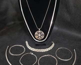 https://ctbids.com/#!/description/share/721150 Beautiful assortment of sterling silver bracelets, necklaces, and pendant. Three bracelets and one necklace are made in Milor, Italy. Authenticity of pendant with stones is unknown. Total weight of sterling pieces is 57 grams.