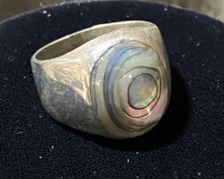 Abolone Shell Ring set in .925 Silver. It is a size 10. 