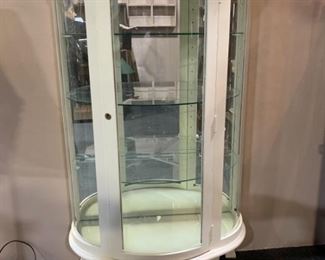 White curio cabinet with glass front sides and shelves.