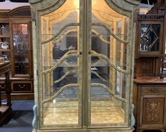Large lighted curio cabinet with glass doors and shelves. Hand painted with gold trim.