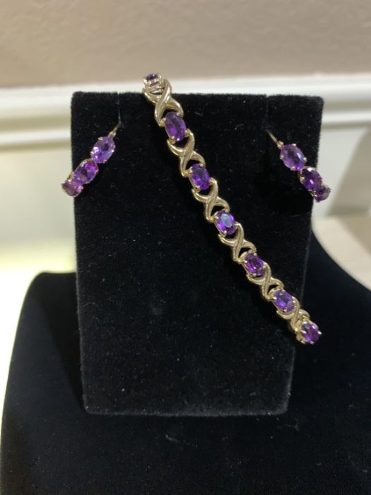 14 karat oval shape Amethyst bracelet and matching hoop earrings. Bracelet is 6 1/2 inches with a safety latch.