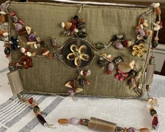 Mary Frances unique, rare to find beaded flower design clutch. Made of fabric embellished with A variety of colored beads and other man made stones. 