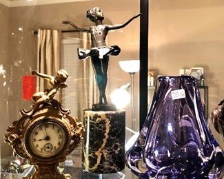Beatiful bronzes, small antique clock, and a Paul Larrie purple glass vase. Love the color!