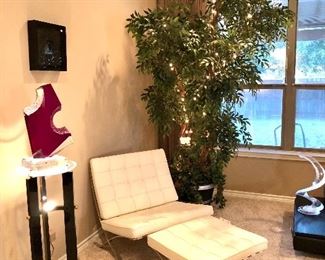 Barcelona leather chair and ottoman.  Don't see this much in white!  Large lighted, ficus artificial tree, 10'!