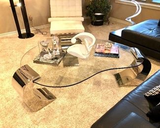 Cantoni glass cocktail table with chrome legs.  This is such a cool piece!
