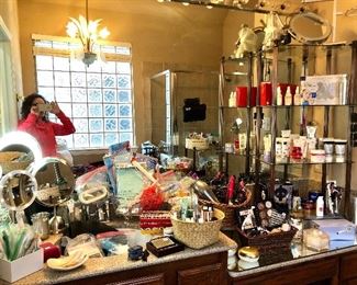 This is the most cosmetics and facial creams-many unused that we've ever seen...and we've seen quite a bit!  This is only one section.  Lots of lighted mirrors and stands.