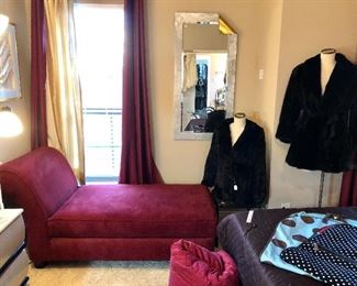 Modern suede red chaise.  See the mirror!  Note the turned down corner!