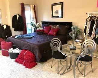 Master bedroom!  Notice the clothes rack to the right.  Full of Eileen Fisher, Misook, and Citron.
