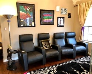4 Cantoni black leather reclining theater seats.  so comfortable!  Retailed around $4K.  Notice the chrome floor lamp.  See the purple acrylic round tube beneath.  Interesting!