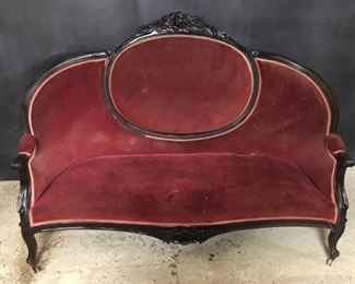 Victorian medallion back sofa. Sofa is probably Civil War vintage. Likely is walnut/mahogany. Upholstery looks to be from 1960’s-70’s. Has ornate carving Above medallion and below center of seat. As is usual with these old sofas many of the glue joints are lose.