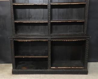 Carved oak shelf unit. Hand carved oak with Jacobean dark stain. It is about 74.5 inches wide. Total height is about 68.5 inches. The base is 38 inches high. The upper part is about 11 inches deep. The lower part is about 21.5 inches deep.