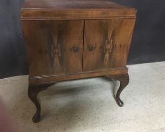 Record player. The wood is Circassian walnut. The
player needs some adjusting but does work. D’Amophne is the brand name.