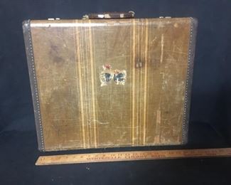 Suitcase. Vintage 21 inch suitcase. Shows some ware.