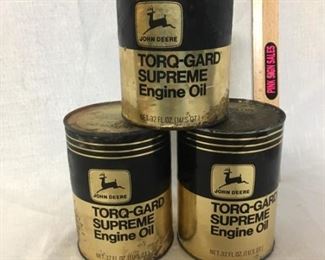 Oil cans. Cardboard cans. John Deere engine oil.
All contain oil.