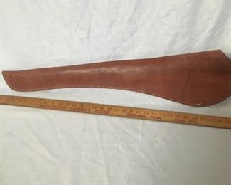 Heavy leather rifle scabbed to use on a saddle.
