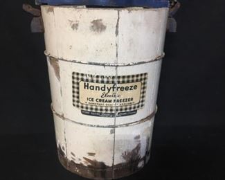 Ice cream freezer. Early electric freezer. Housing for motor is missing. Lid to can is missing. One of the bails around the bucket is missing.