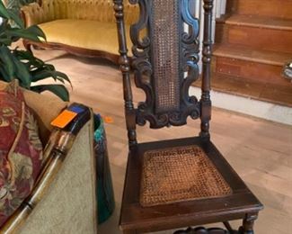 #60 - $120 Jacobean style high back carved chair, cane seat. 