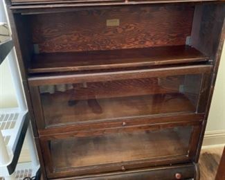 #79 - $300 - Lawyers bookcase LUNDSTROM top door need the stain glass to be re-attached in 33 1/2" x 11 1/2" x 47"T (we know whom can do it for you)