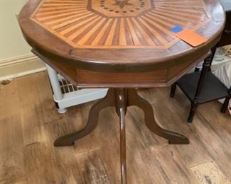 #81 - $120 - Octagonal table, inlaid with star in center 24 3/4"W x 28 1/2"H