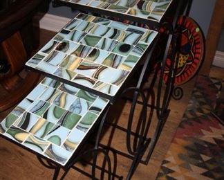 $65. Three iron and tile topped nesting tables.