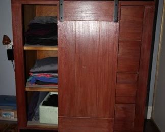 $175. Four drawer with sliding barn door cabinet and shelves.