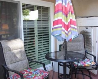$200. Five piece, outdoor tall bistro set. two swivel chairs, high table, umbrella and stand.