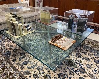 Mies Van Der Rohe coffee table
note: the library model shown on coffee will not be available for purchase