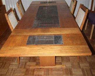 $750.  Drop leaf table with tiles down the center with four chairs. Gangso Moebler.