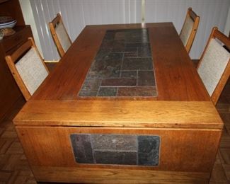 $750.  Drop leaf table with tiles down the center with four chairs. Gangso Moebler.