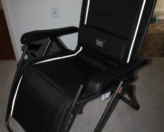 $30. Folding sun lounger/chair with attached table.