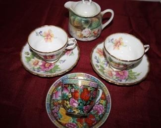 $15. pair of English bone china cups and saucers.              $6. Japanese cup and saucer.                                                          $12. German creamer. (Sold)