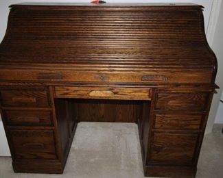 $150. Roll top desk with filing drawers and plenty of other storage areas. 54x29x45.