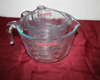 $12. Three Pyrex mixing/measuring jugs.