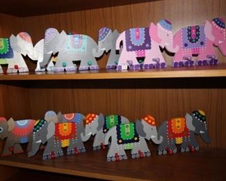$10 each. Hand made by Nyla, wooden elephant themed coat pegs.