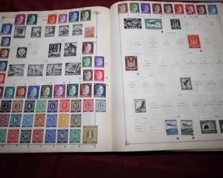 $45. Stamp collection album and bags of stamps.