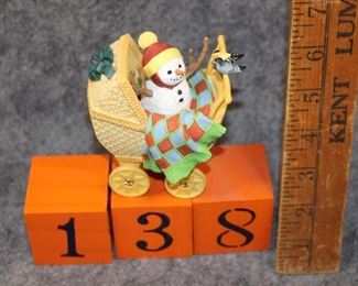 138: Snow Bundle. Now $6.  Was $10.  Lenox snowman by Lynn Bywaters - 1990s.  New in box - excellent condition.  Snow baby and carriage