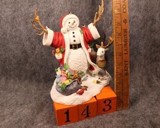 143: Christmas Greetings.  Now $20.  Was $35.  Santa themed group figurine. Lenox snowman by Lynn Bywaters - 1990s.  New in box - excellent condition.  