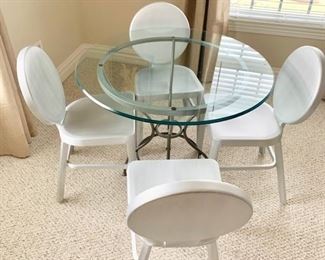 107. Set of 4 Aluminum Side Chairs (16" x 16" x 32")
108. Round Glass Top Table on Metal Base (36" x 29")