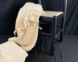 Black Woven Chair and Antique Blanket