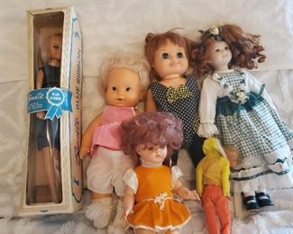 Several collectible dolls